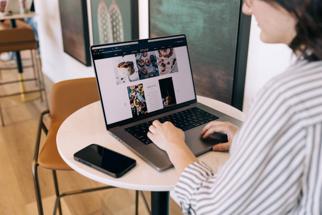 Showit vs. Behance: someone viewing a portfolio on a computer