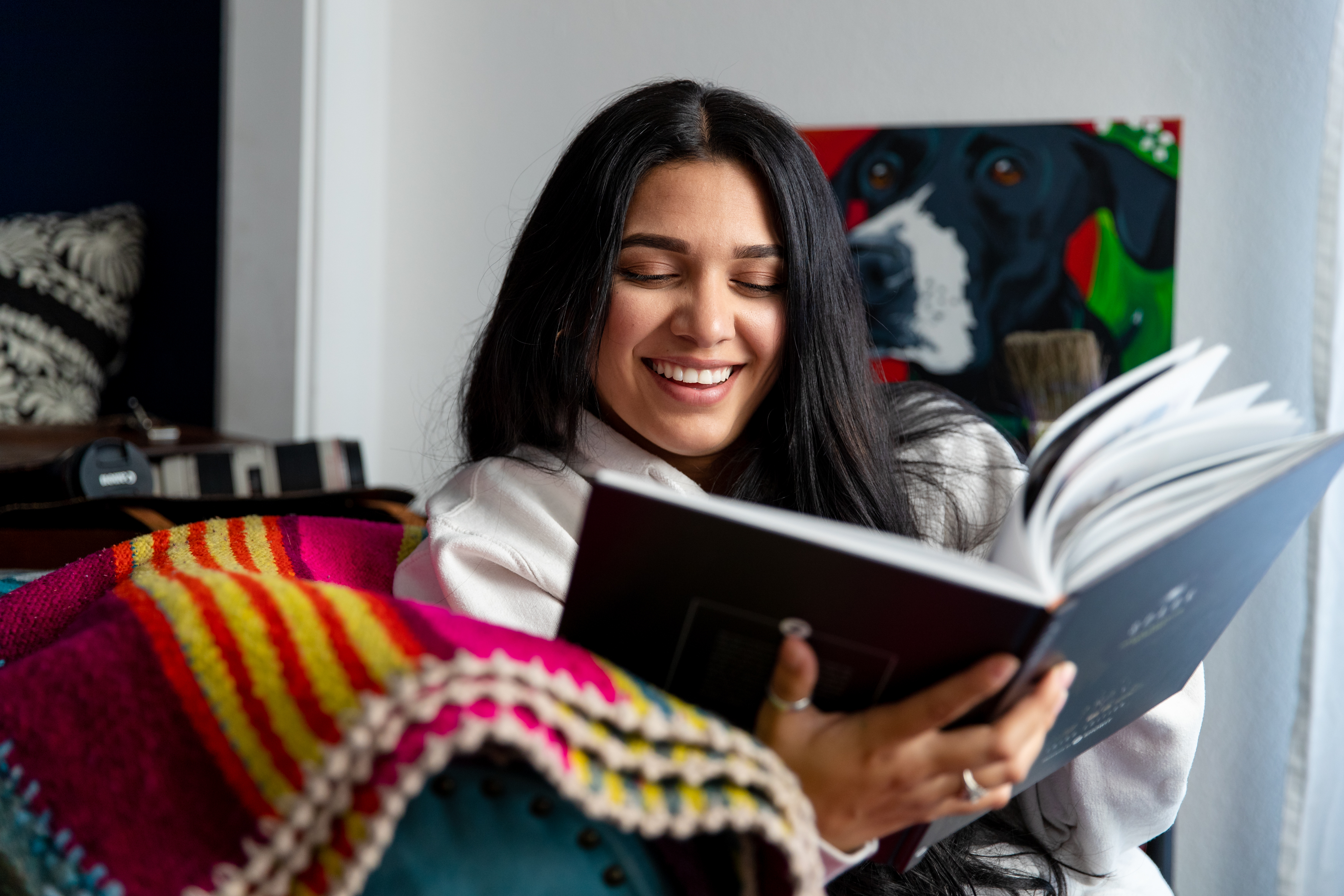 girl reading book to unlock success in her business.